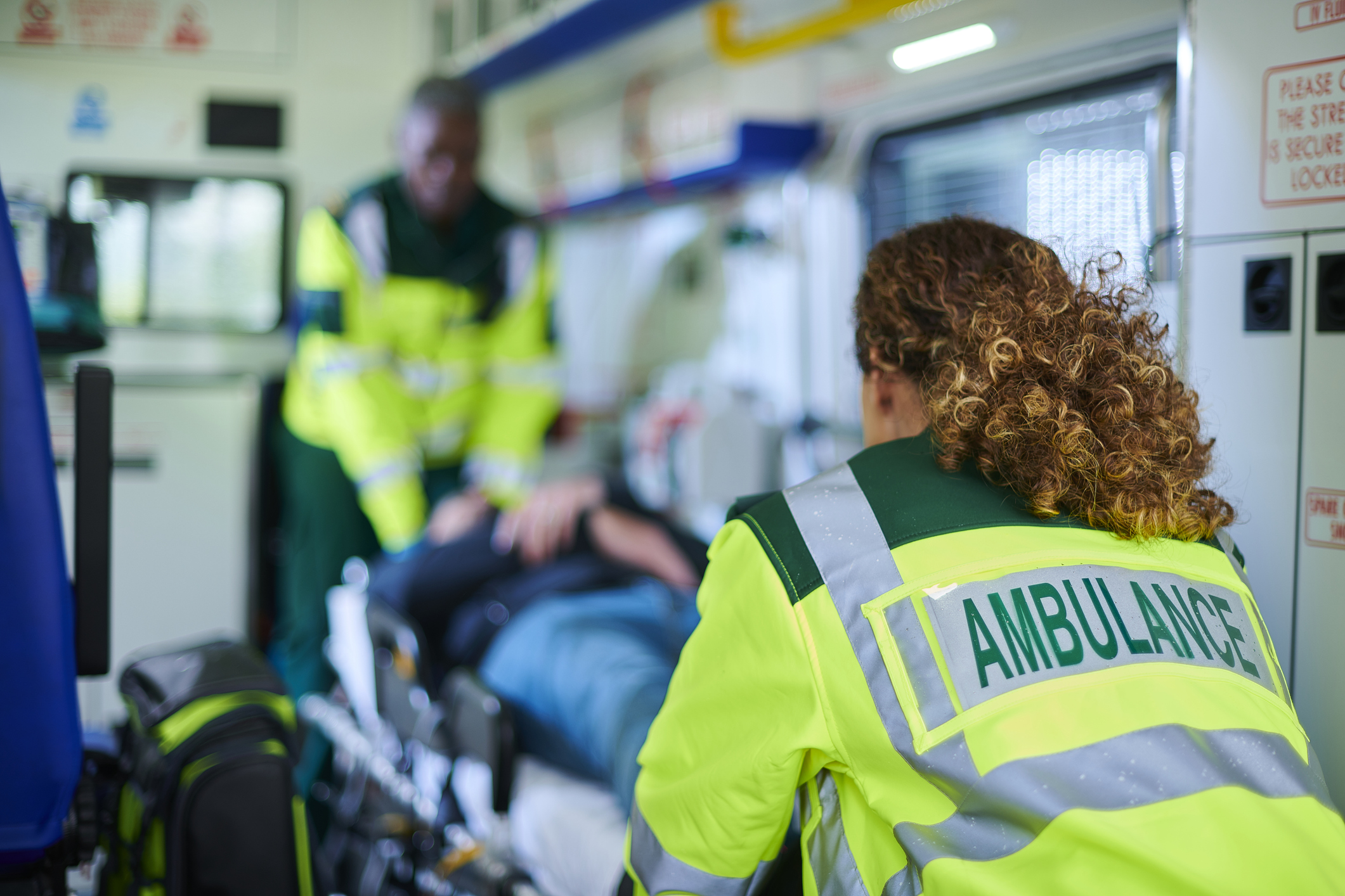 ambulance crew preparing patient for transportation